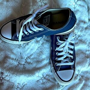Fairly worn, navy blue converse All-Star low tops